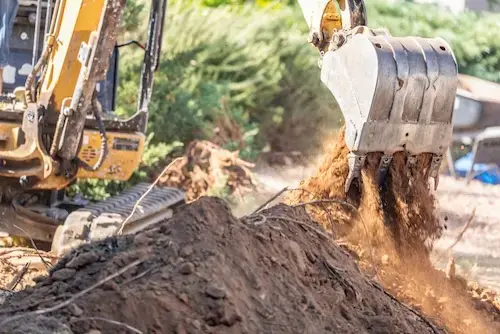 Backhoe performing excavation work.
